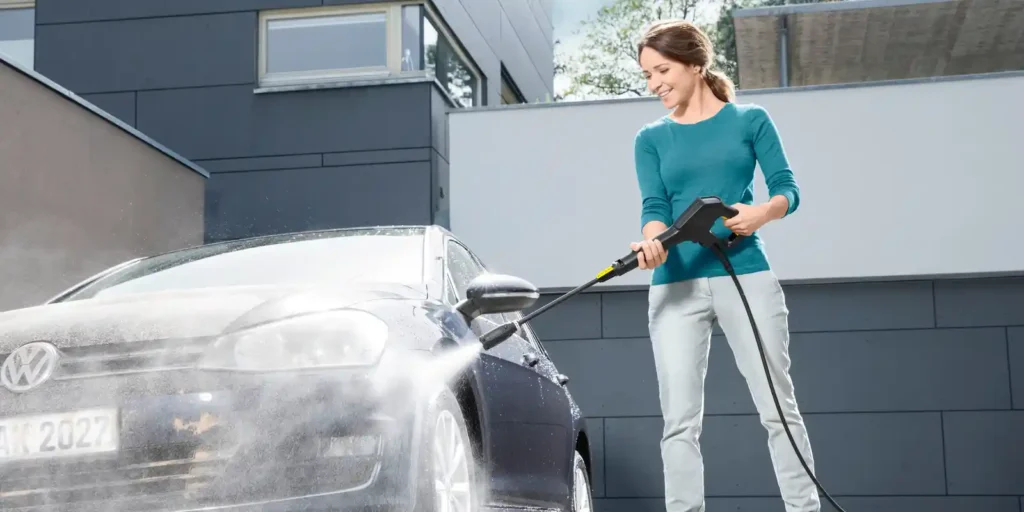 Cleaning cars with pressure washer