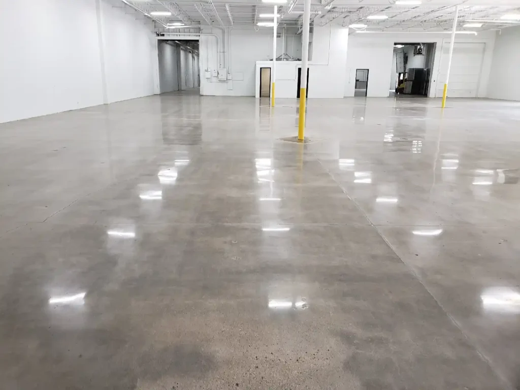 Step-by-step garage floor cleaning in progress