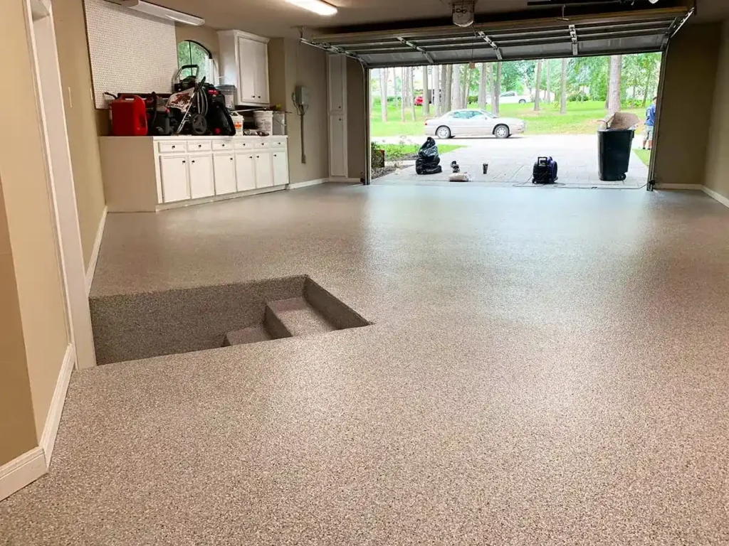 Epoxy-coated garage floor during routine cleaning process