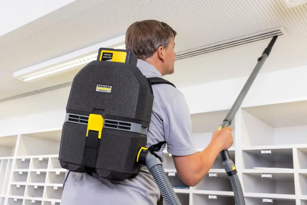 Backpack Vacuum using to cleaning roof cealing