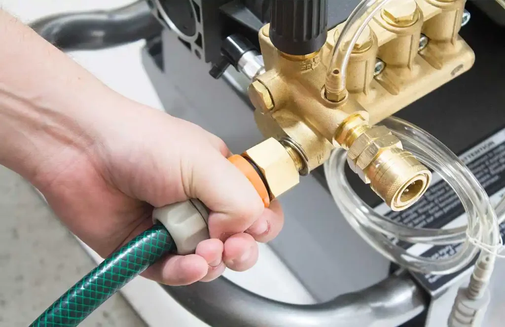attach a green garden hose to a Kärcher pressure washer
