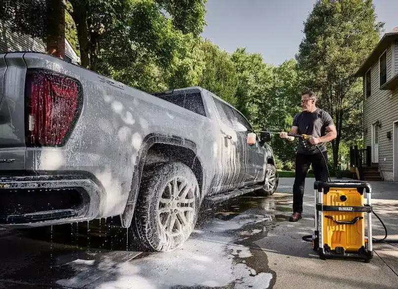 dewalt pressure washer in use for cleaning car
